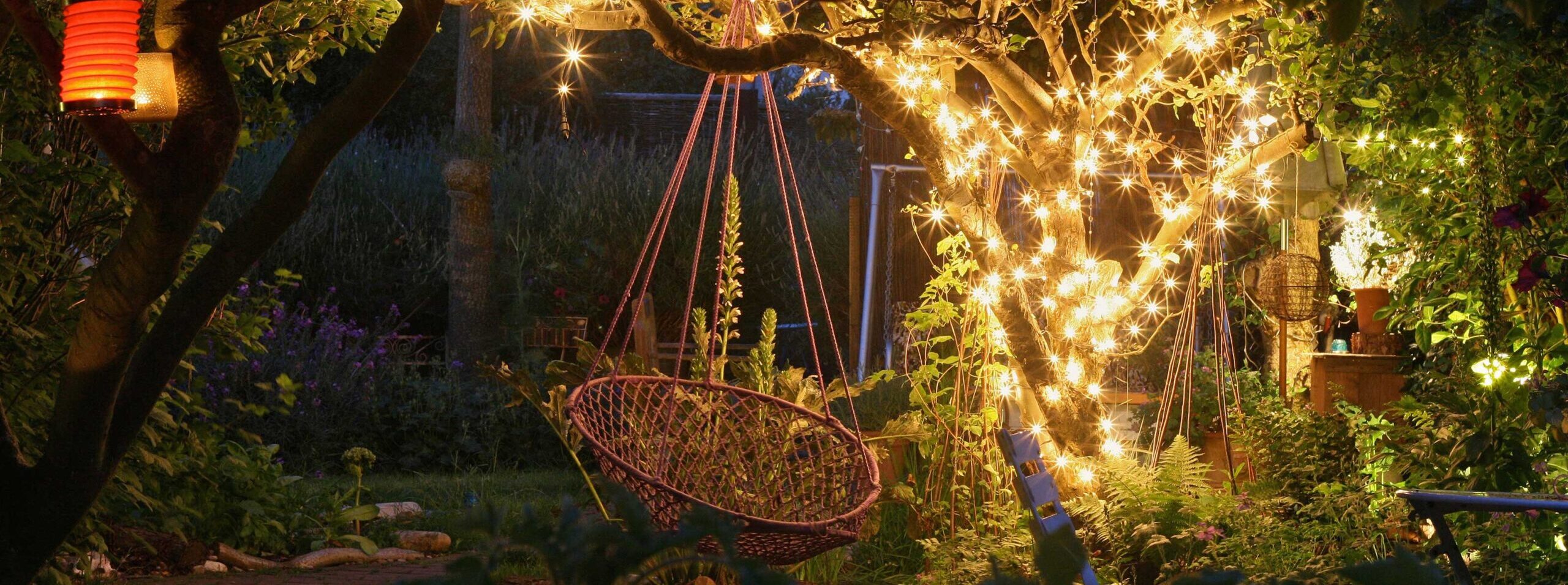 Garden at night with lanterns and fairy lights. Image shot 06/2008. Exact date unknown.